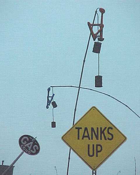 11/20/01-- Car Series, Tanks Up (pipes, pumps, tanks, signs)