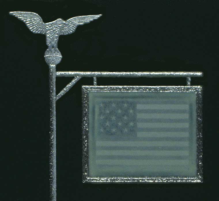 View of a darkened landscape-- detail of a flag of 1814 encased and suspended from a pole