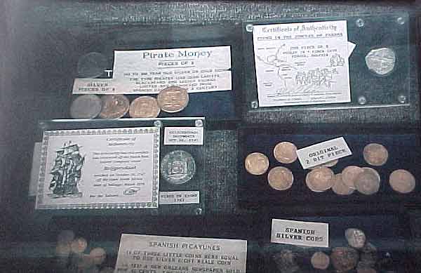 View of objects in the display window of a coin shop on Royal Street in New Orleans