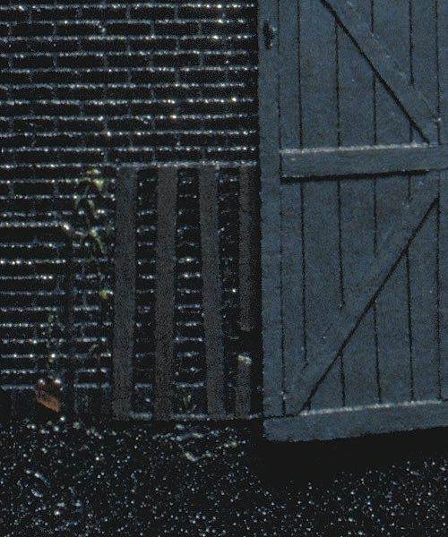 Detail of an apocalyptic vision, concealed behind a pair of innocuous-looking barn doors-- debris left.